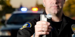 police officer with breathalyzer - Missouri DUI