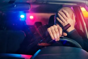 man drinking a beer at the wheel - Springfield charged with DWI